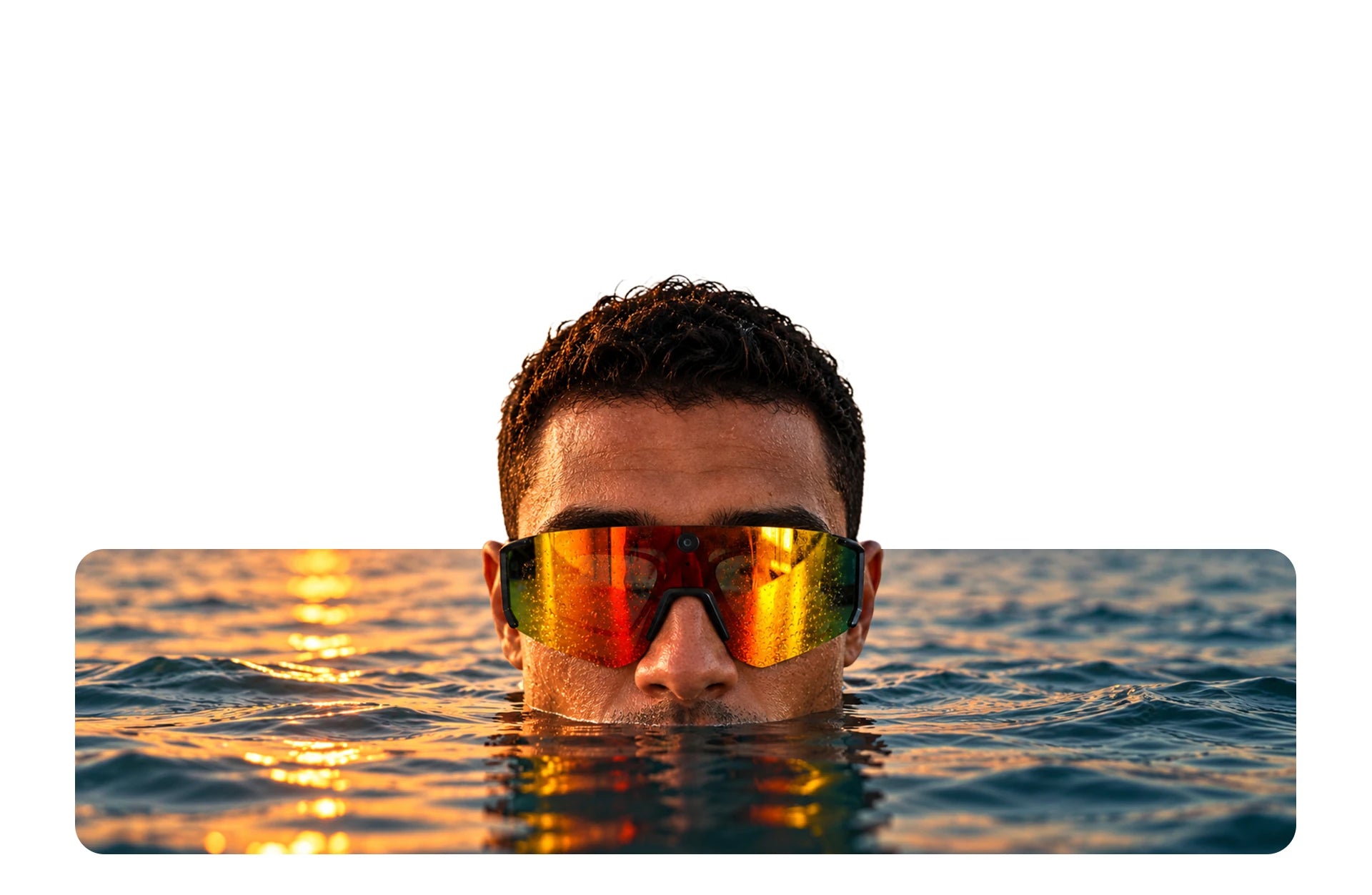 A man wearing the glasses, rising out of the water