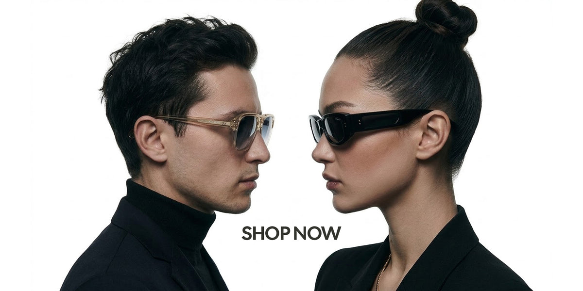 A man and a woman in black clothing wearing sunglasses, shown in profile against a white background with the text 'SHOP NOW' between them.
